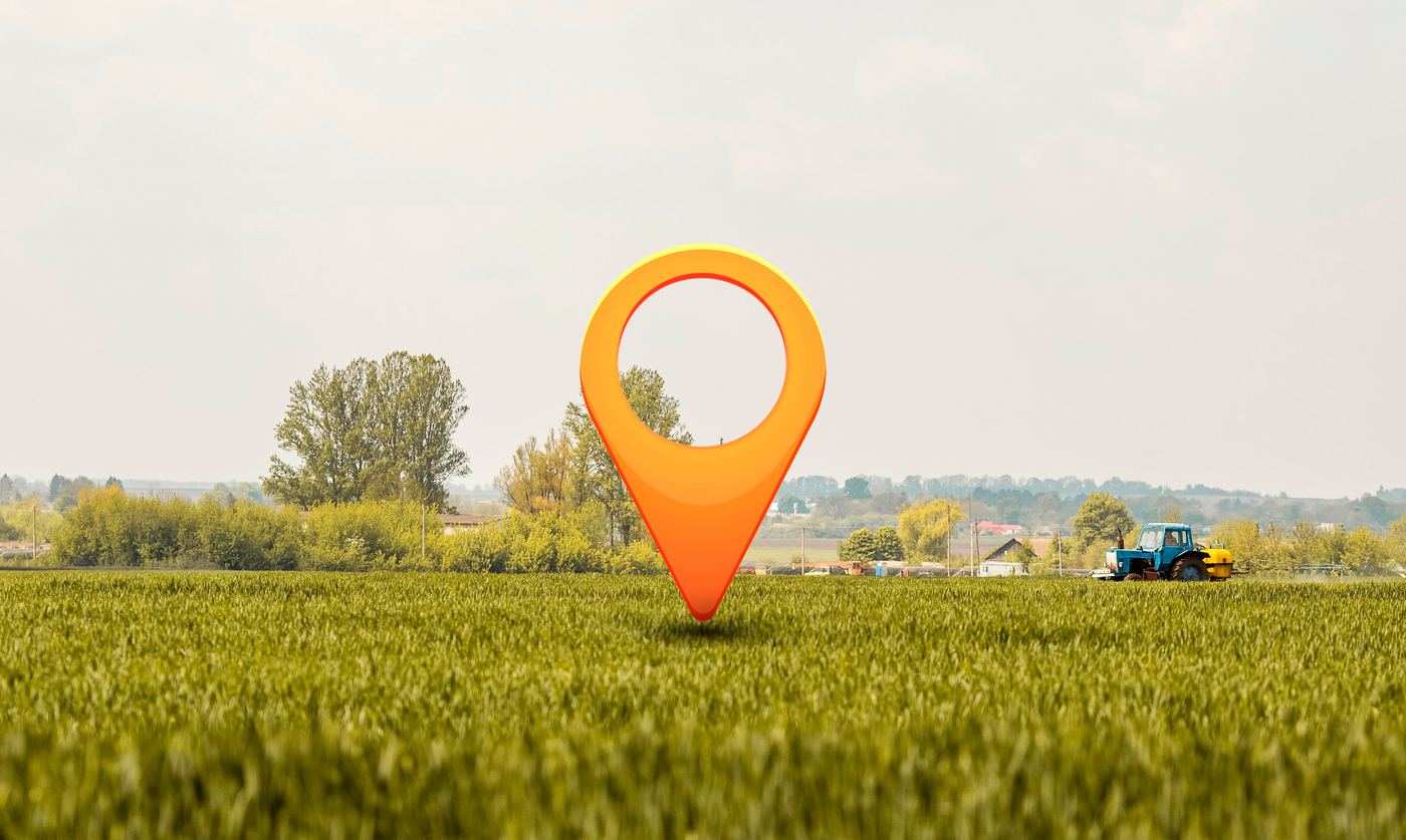 Pin de localização sobre um campo aberto, representando o negócio que ainda não aparece no mapa